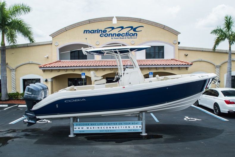 Thumbnail 1 for Used 2014 Cobia 256 Center Console boat for sale in Vero Beach, FL
