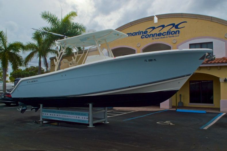 Thumbnail 1 for Used 2013 Cobia 296 Center Console boat for sale in West Palm Beach, FL