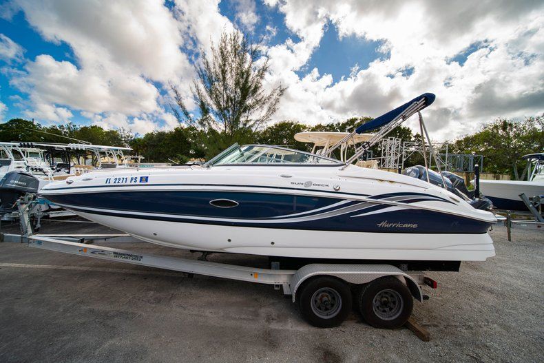 Thumbnail 1 for Used 2013 Hurricane SunDeck SD 2400 OB boat for sale in West Palm Beach, FL